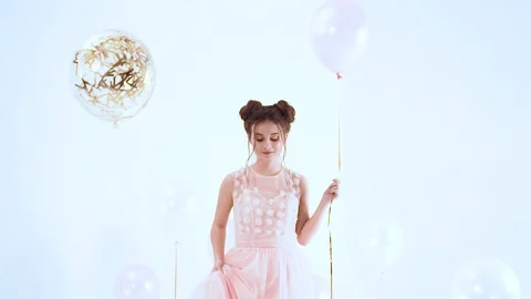 Pretty model in a long lush pink dress goes to the podium holds in her hand a Stock Footage 100202091