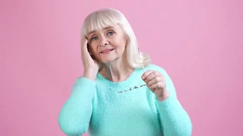 Pretty old lady prepare event hair care isolated pastel color background Stock Footage 169288330