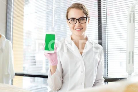 Pretty Physician with Modern Smartphone Stock Photos