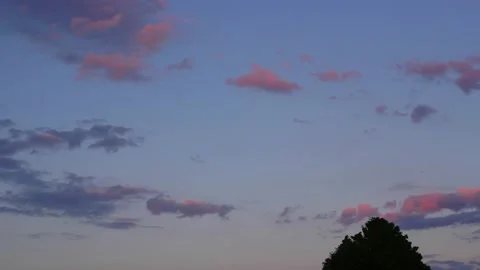 Pretty pink and blue clouds at the end of the day. Stock Footage 132543434