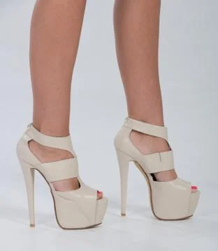 Pretty in platform leather heels Stock Photos