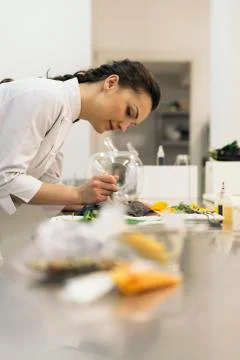Pretty professional chef cooking. Stock Photos