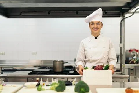 Pretty professional chef cooking. Stock Photos