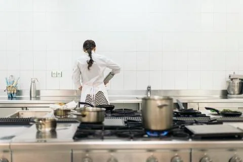 Pretty professional chef cooking. Stock Photos