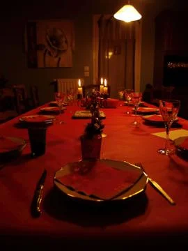 A pretty red table with candles set for the christhmas meal Stock Photos