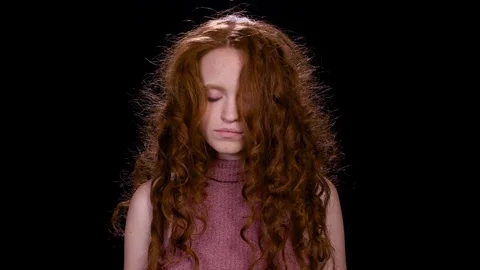 Pretty redhead looks at the camera Stock Footage 100420974
