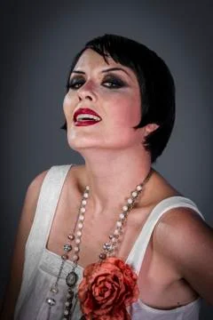 Pretty retro posing lady,  flapper dress, girl dreaming beautiful young woman Stock Photos