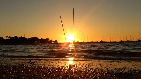 Pretty sailing bats on a beach harbor close to sunset / sunrise Vídeo Stock 72365332