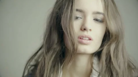 Pretty sharp turns his head from side to side, smiling. Stock Footage 61081410