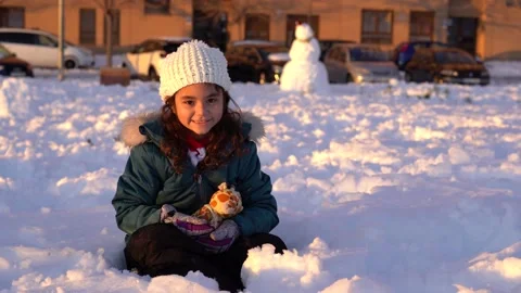 Pretty short haired girl playing with toy and smiling to camera to camera dur Stock Footage 146473503
