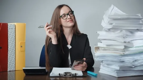 Pretty smiling office worker dreaming in the office after hard working day Stock-Footage 124775220