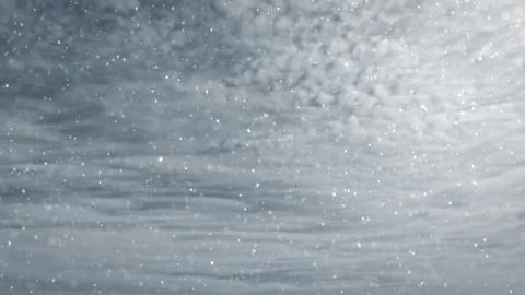 Pretty snowfall on clouds on sky background - photo of nature 写真素材