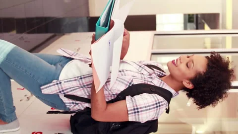 Pretty student revising and smiling at camera with thumbs up Video stock 302139715