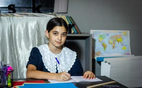 Pretty student studying in classroom Фото