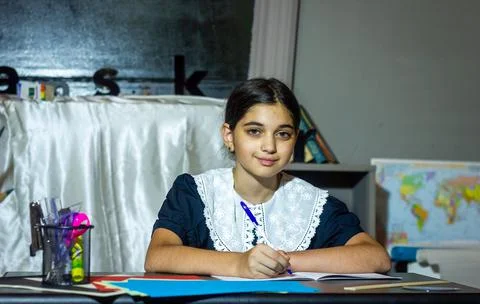 Pretty student studying in classroom Stock Photos