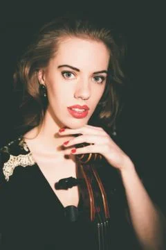 Pretty stylish young classical cellist Stock Photos