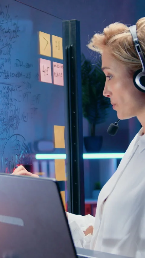 Pretty successful responsible experienced blond female worker communicating with Stock Footage 327232982