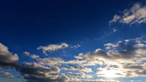 Pretty sundown gold clouds on the sky background - photo of nature Foto stock