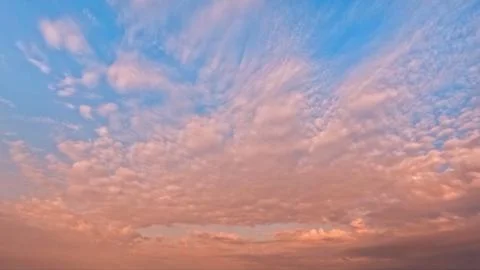 Pretty sundown goldish clouds on the sky bg - photo of nature Stock Photos