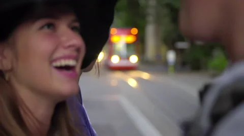 Pretty teen laughs while waiting for train Stock Footage 54260189