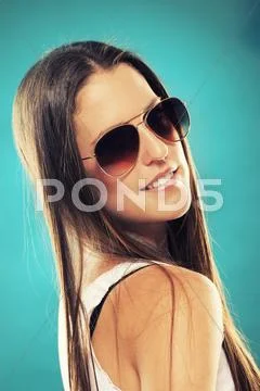 Pretty teenager wearing sunglasses Stock Photos