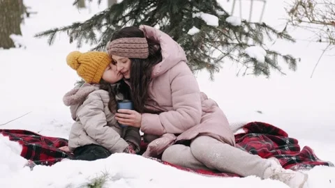 Pretty woman and daughter in warm Stock Video Pond5