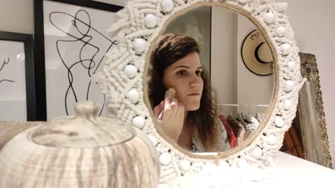 Pretty Woman Doing Makeup In Front Of Mirror Stock Footage 145993153