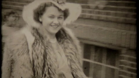 Pretty woman dressed in lastest fur fashion 1940s vintage film home movie 3118 Stock Footage