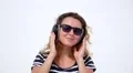 Pretty Woman Listening Music in Headphones Earphones and Laughing. HD Footage
