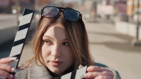 Pretty woman looking down thoughtful, soft sunlight on freckles, sunglasses on Stock Footage 337655682