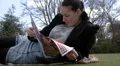 Pretty woman lying on grass by herself HD Footage