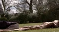 Pretty woman lying on grass by herself HD Footage
