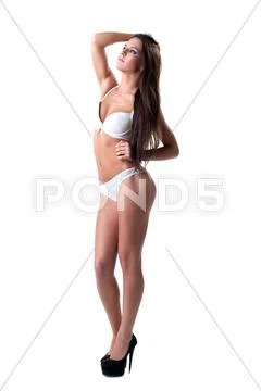 Pretty woman posing in sexy lingerie isolated Stock Photos