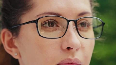 Pretty woman read message on her smart glasses Stock Footage