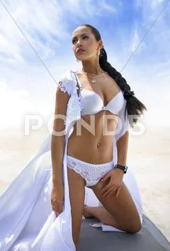 Pretty woman on the sea shore Stock Photos