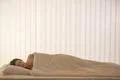 The pretty woman sleeping in the bed Photo