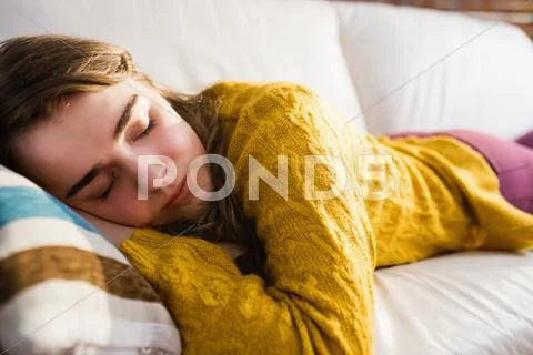 Pretty woman sleeping on the couch Stock Photos