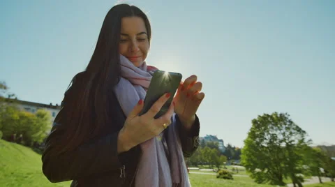 Pretty woman with smartphone standing Stock Footage 68616341