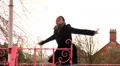 Pretty woman spins in bandstand HD Footage