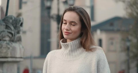 Pretty Woman Standing in front of Camera while standing in City Center. Video stock 121168439