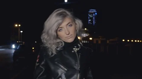 Pretty woman on street at night Stock Footage