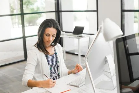 Pretty woman using computer Stock Photos