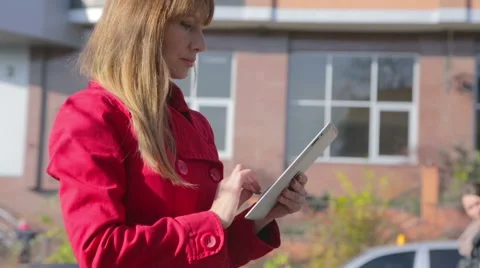 Pretty woman using tablet pc outdoor Stock Footage 43833665