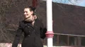 Pretty woman waits alone outside, happy HD Footage