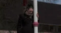 Pretty woman waits alone outside, stood up HD Footage