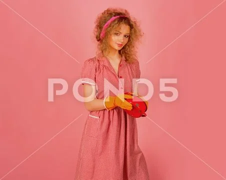 Pretty woman wash dirty pot in gloves. Housewife wash up after meal. My kitchen Stock Photos