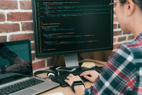 Pretty woman worker programmer using computer Stock Photos