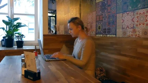 Pretty Woman Working On Laptop In Cafe, 4K Stock Footage