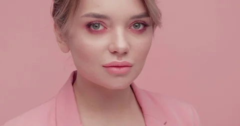Pretty Woman’s Face with beautiful Features standing in front of Camera and Vídeo Stock 126157489