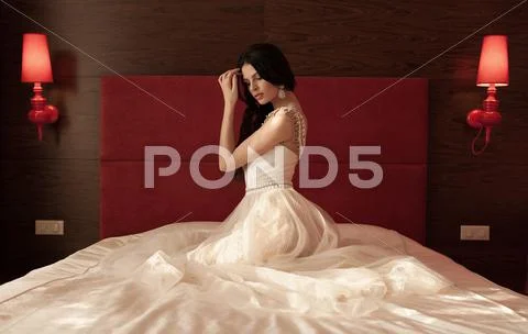 Pretty young brunette bride Stock Photos